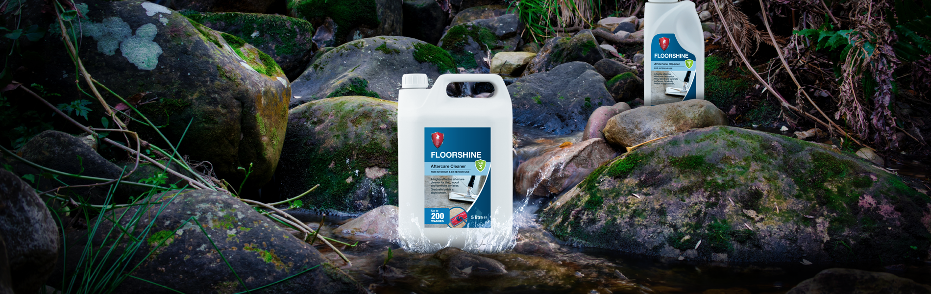 LTP Floorshine bottles on a waterfall pond area in a forest