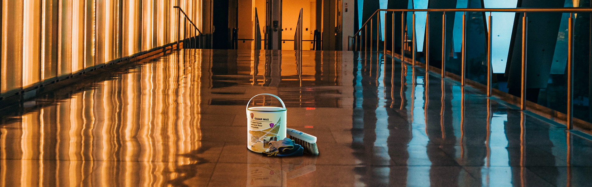 A tin of LTP Clear Wax with application tools in a corridor, lit up with bright blue and orange lighting