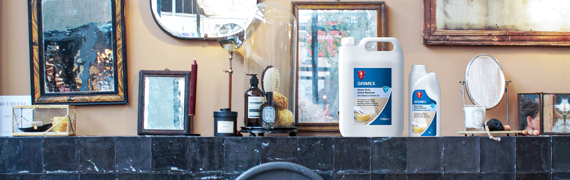 LTP Grimex bottles on a black, tiled shelf in a bathroom